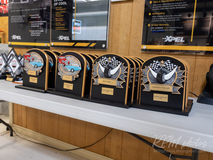 A table filled with trophies for Octane Fest at The Stable Performance Cars.