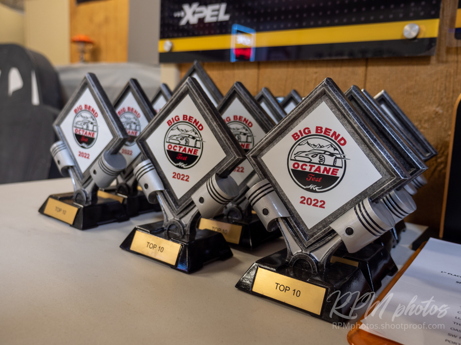 A table filled with trophies for Octane Fest at The Stable Performance Cars.