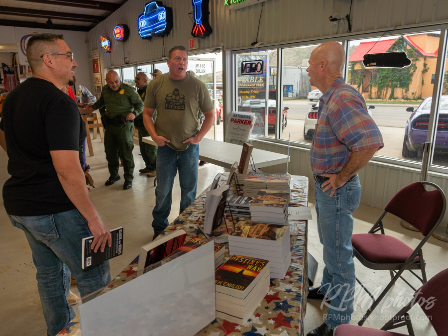 Author Ben H. English talks people at the Law Enforcement Appreciation Dinner at The Stable Performance Cars during Octane Fest.