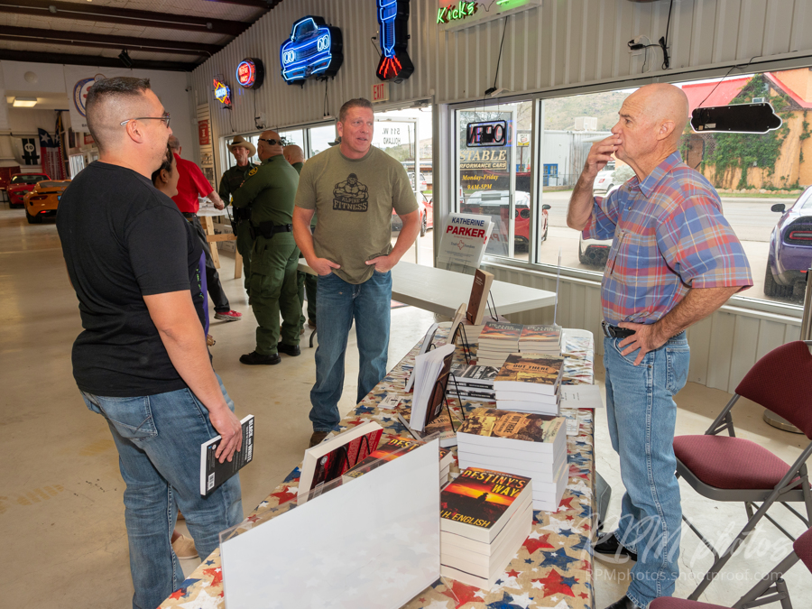 Author Ben H. English talks people at the Law Enforcement Appreciation Dinner at The Stable Performance Cars during Octane Fest.