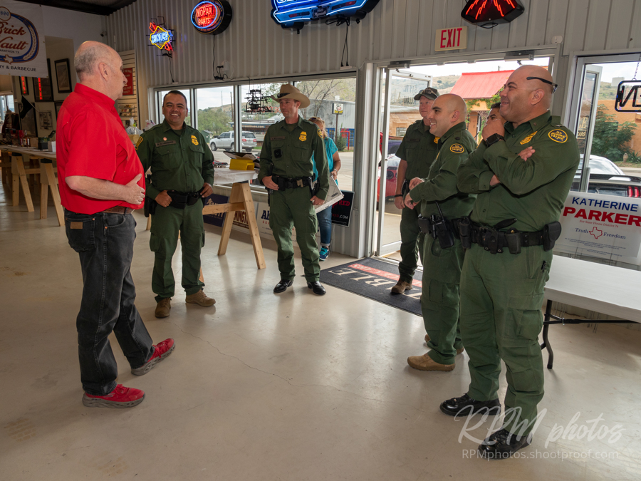 Border Patrol agents enjoy the Law Enforcement Appreciation Dinner at The Stable Performance Cars during Octane Fest and are greeted by owner Dave Durant.