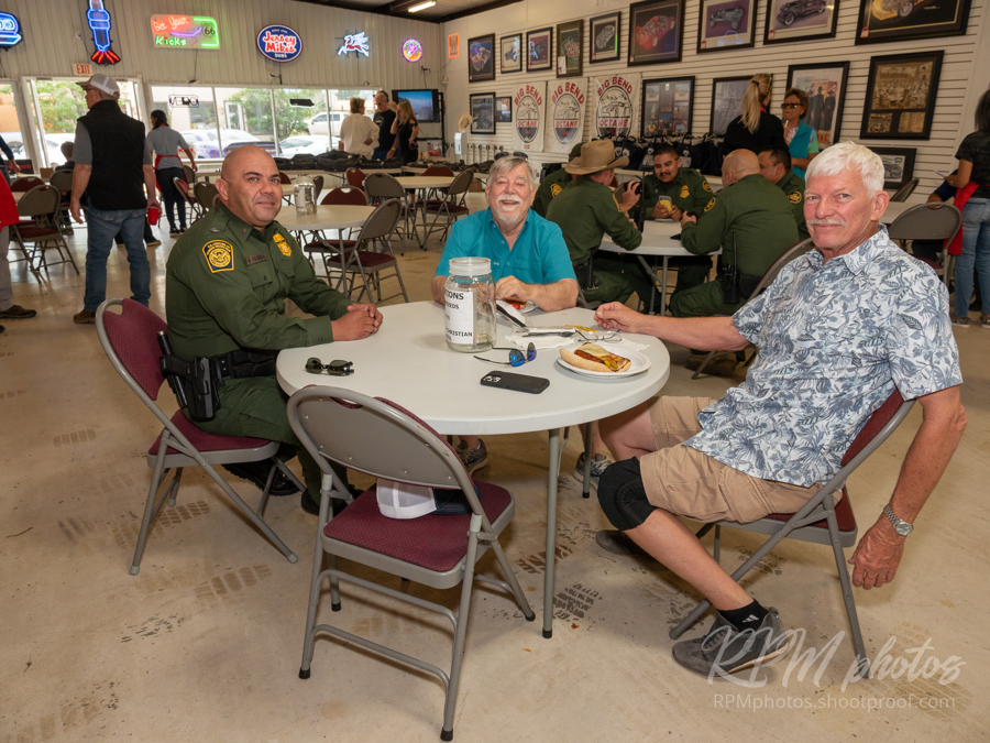 People enjoy the Law Enforcement Appreciation Dinner at The Stable Performance Cars during Octane Fest.