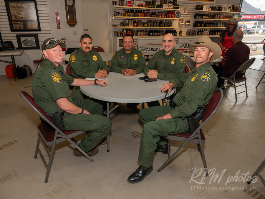 Border Patrol agents enjoy the Law Enforcement Appreciation Dinner at The Stable Performance Cars during Octane Fest.