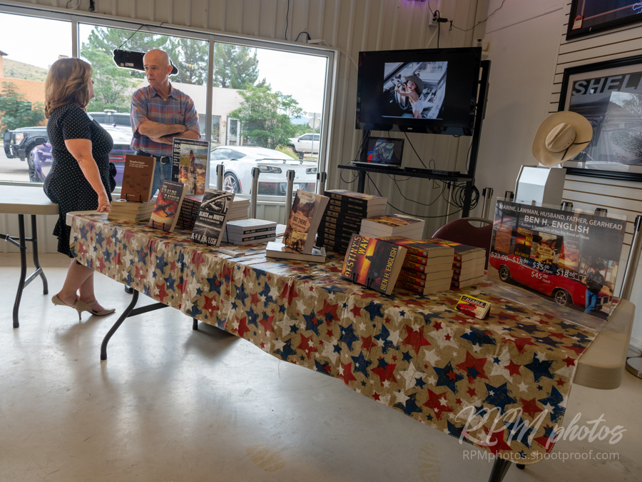 Author Ben H. English talks with Alpine Mayor Catherine Eves at the Law Enforcement Appreciation Dinner at The Stable Performance Cars during Octane Fest.