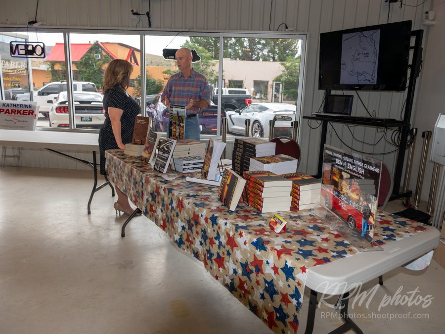 Author Ben H. English talks with Alpine Mayor Catherine Eves at the Law Enforcement Appreciation Dinner at The Stable Performance Cars during Octane Fest.