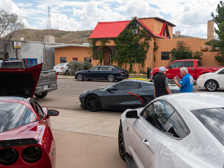 People enjoy looking at high performance cars parked at The Stable Performance Cars during Octane Fest.