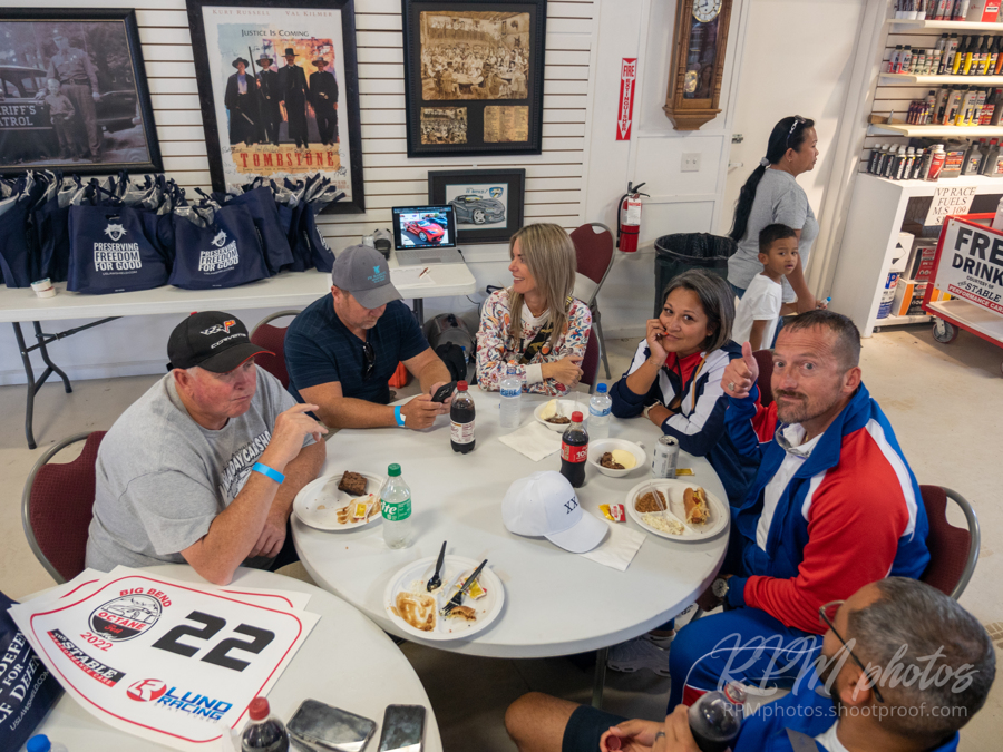 People enjoy burgers and fajitas during the Law Enforcement Appreciation Dinner at The Stable Performance Cars during Octane Fest.