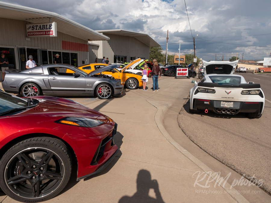 People enjoy looking at beautiful high performance cars during a car show at The Stable Performance Cars during Octane Fest.