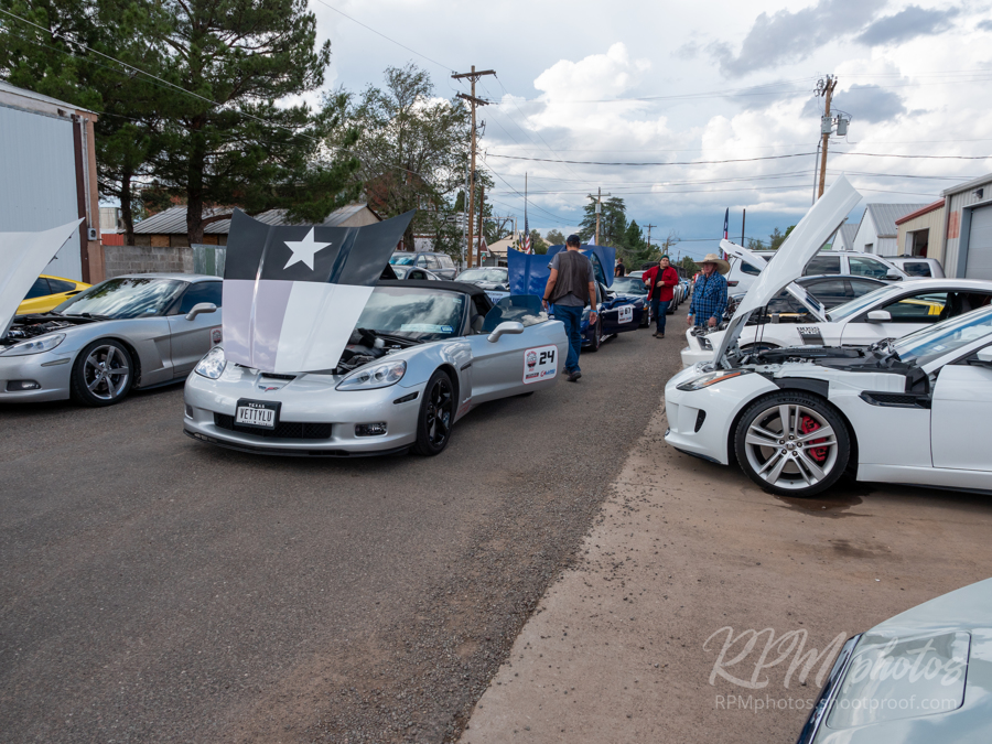 Several high performance cars are parked in the street during a car show at The Stable Performance Cars during Octane Fest.